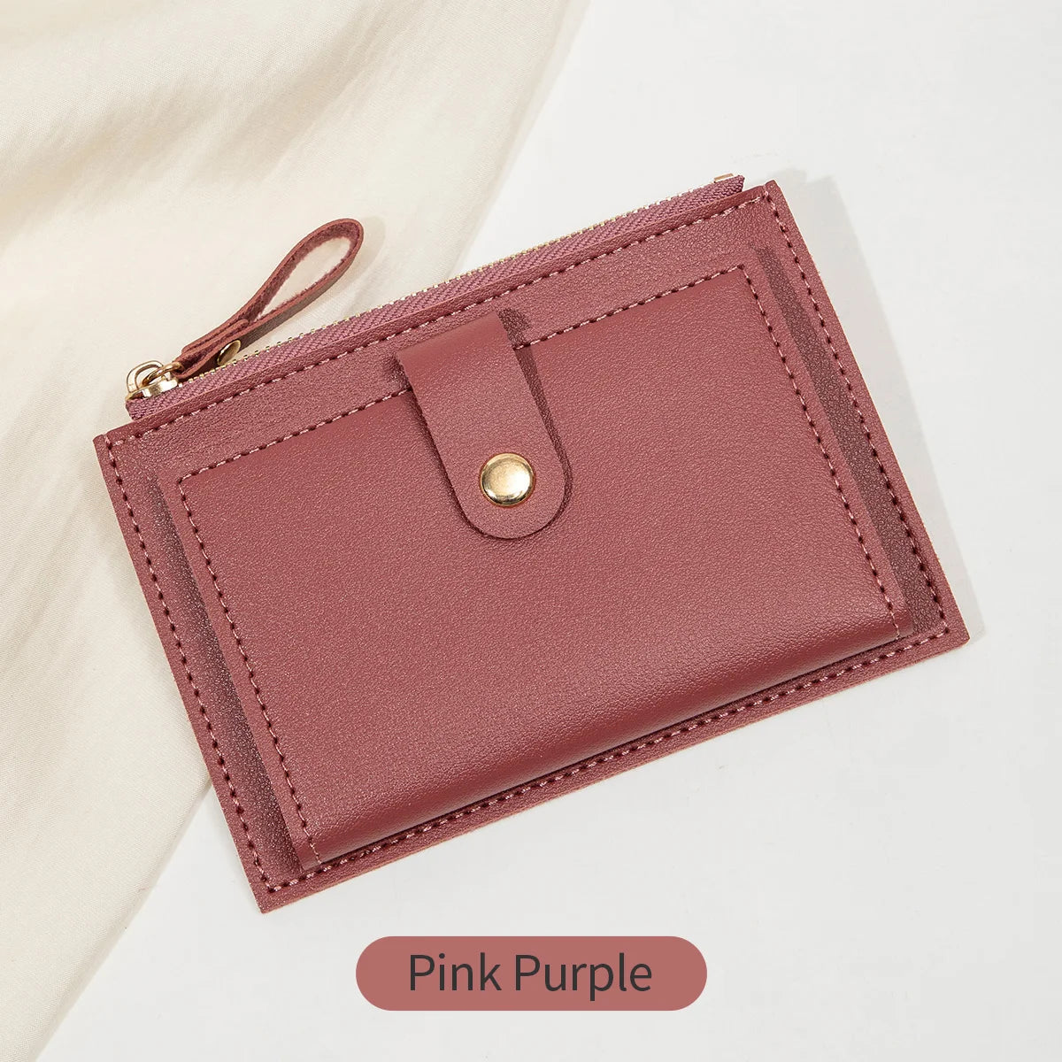 Yaffa Jana mini card wallet in beige, black, pink and blue