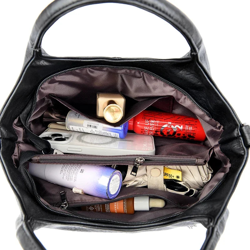 Yaffa Haya soft leather tote bag in red, black and coffee