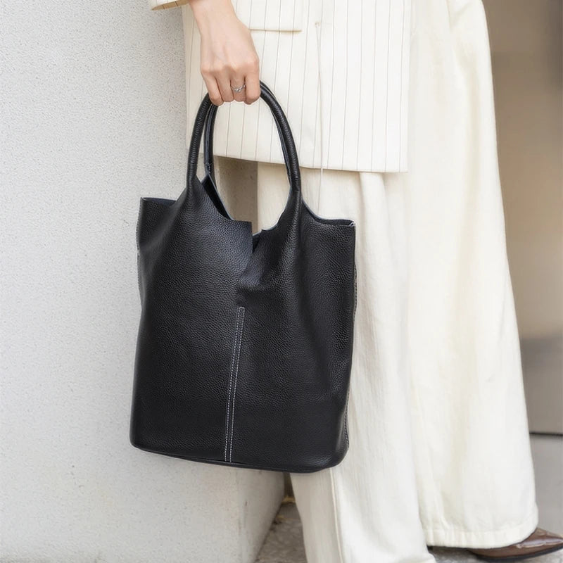 Yaffa Maya leather bucket tote bag in caramel, blue, black, khaki and gray