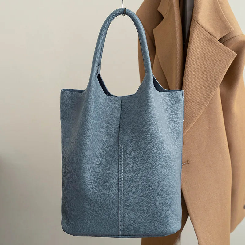 Yaffa Maya leather bucket tote bag in caramel, blue, black, khaki and gray