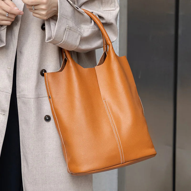 Yaffa Maya leather bucket tote bag in caramel, blue, black, khaki and gray