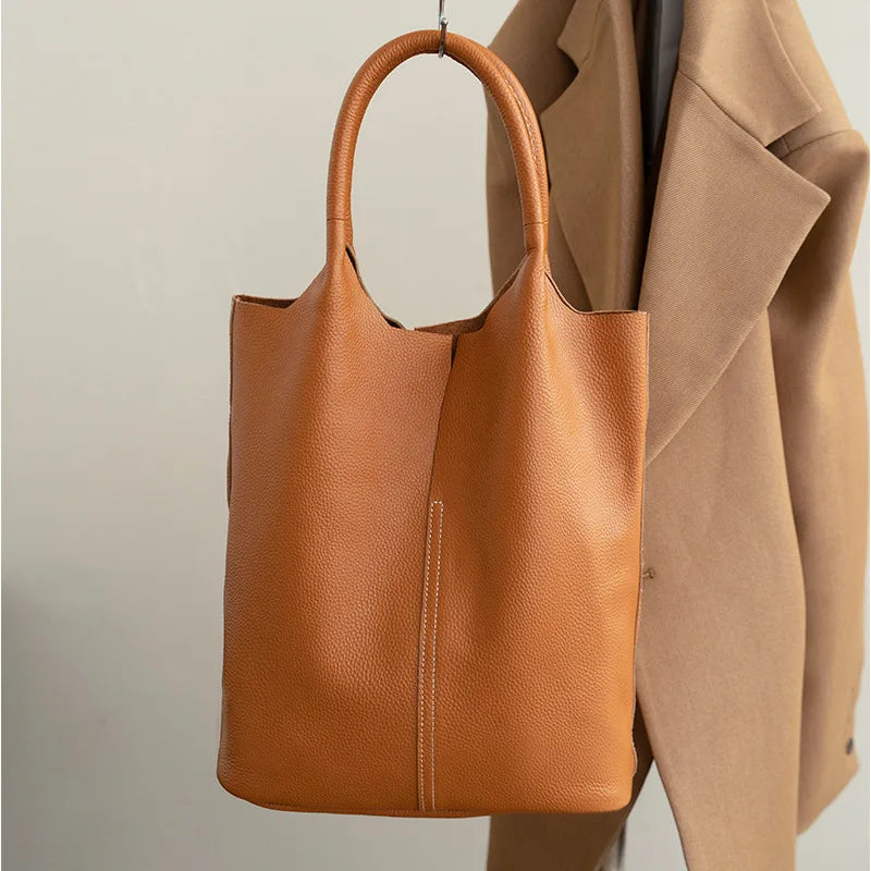 Yaffa Maya leather bucket tote bag in caramel, blue, black, khaki and gray