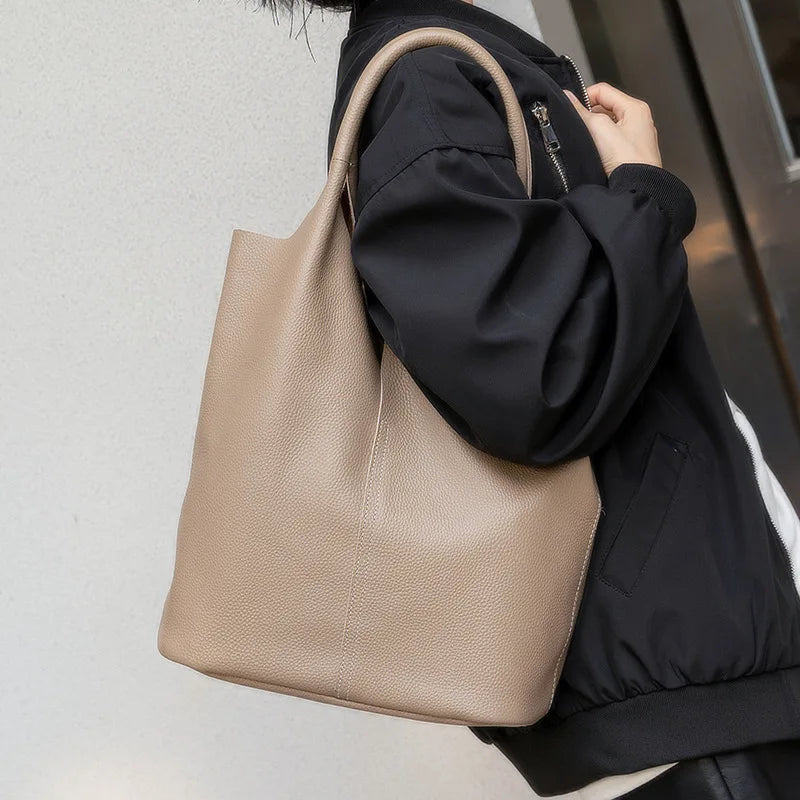 Yaffa Maya leather bucket tote bag in caramel, blue, black, khaki and gray
